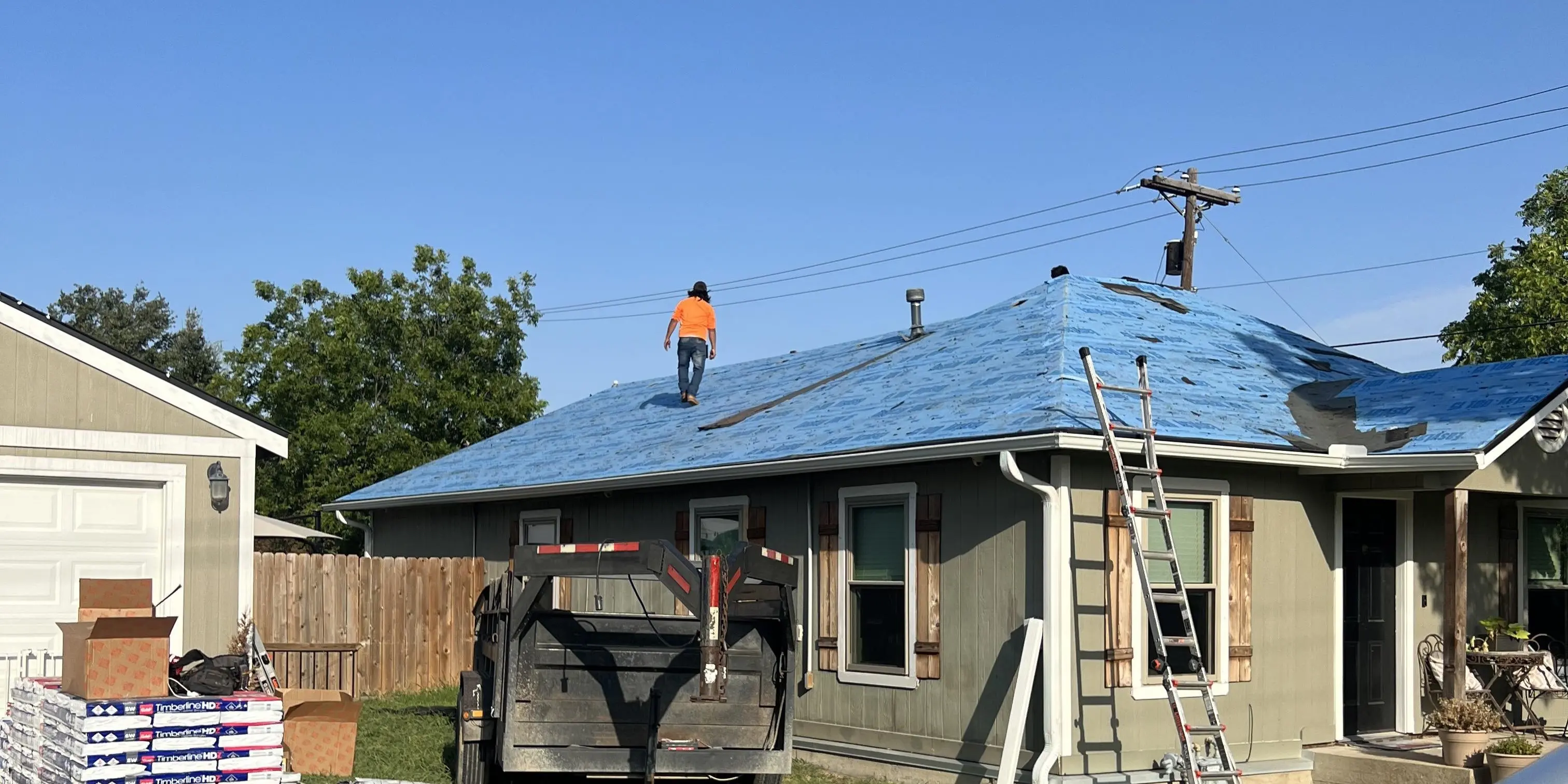 Roof On Texas team members working on a roofing project in Waco, Texas
